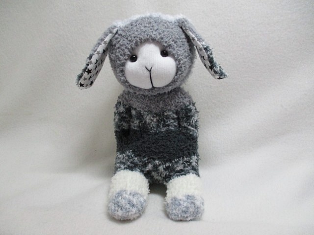Soft cuddly handmade soft sock toy in shades of grey. Ears are line with poly/cotton fabric.