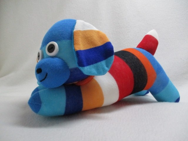 Bright colourful striped puppy handmade from socks. UKCA approved and hand-washable.